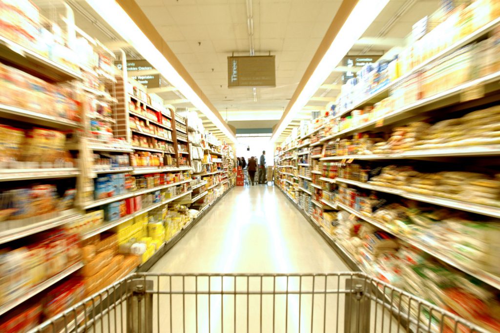 Shopping cart speeding down a long aisle